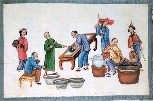 Cutting up the opium balls and mixing the drug with tobacco. From a 19th-century album 'The Evils of Opium Smoking'.